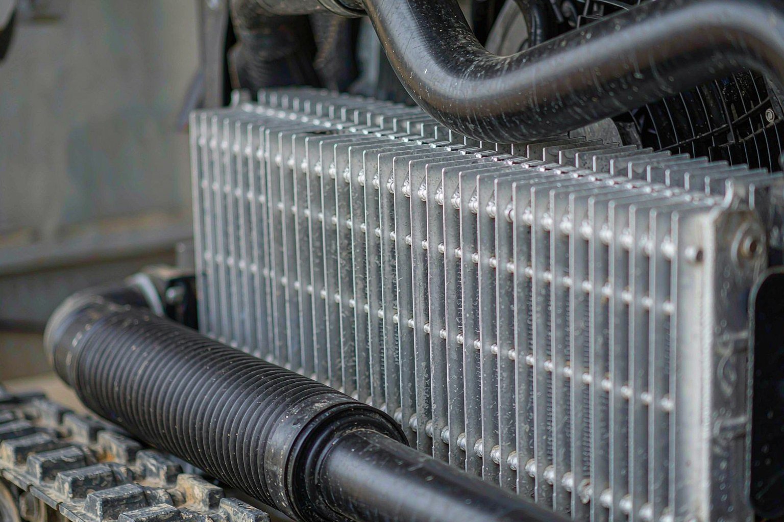 Hydraulic oil cooler radiator with aluminum cooling fins on an excavator